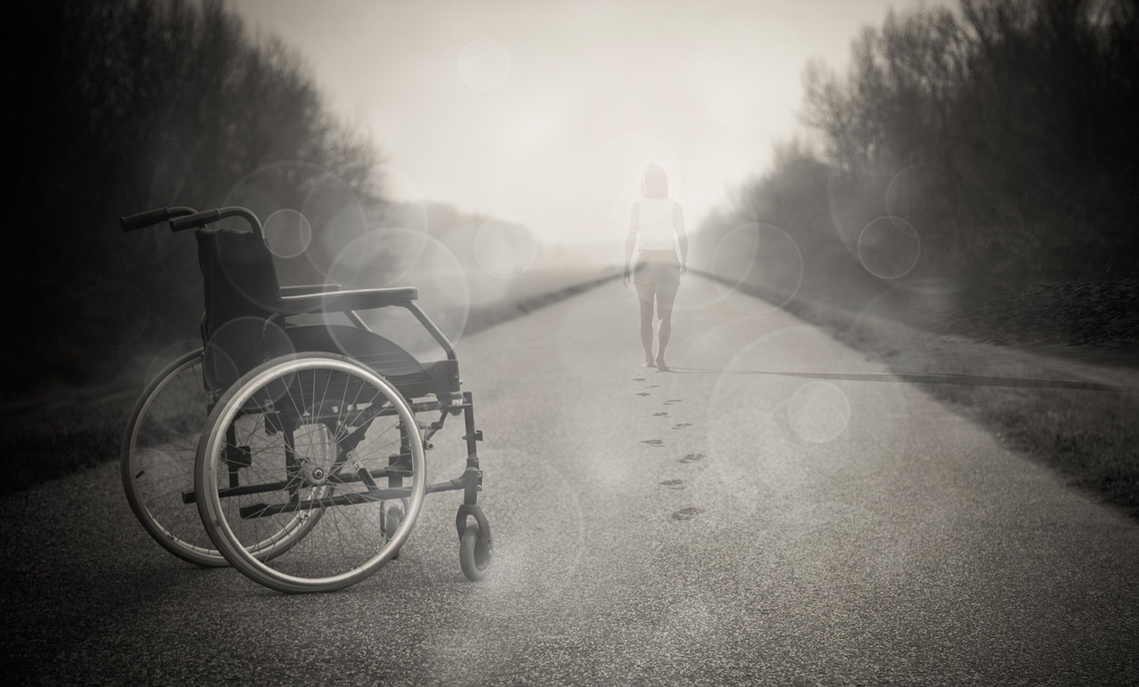 Person leaving a wheelchair and walking away